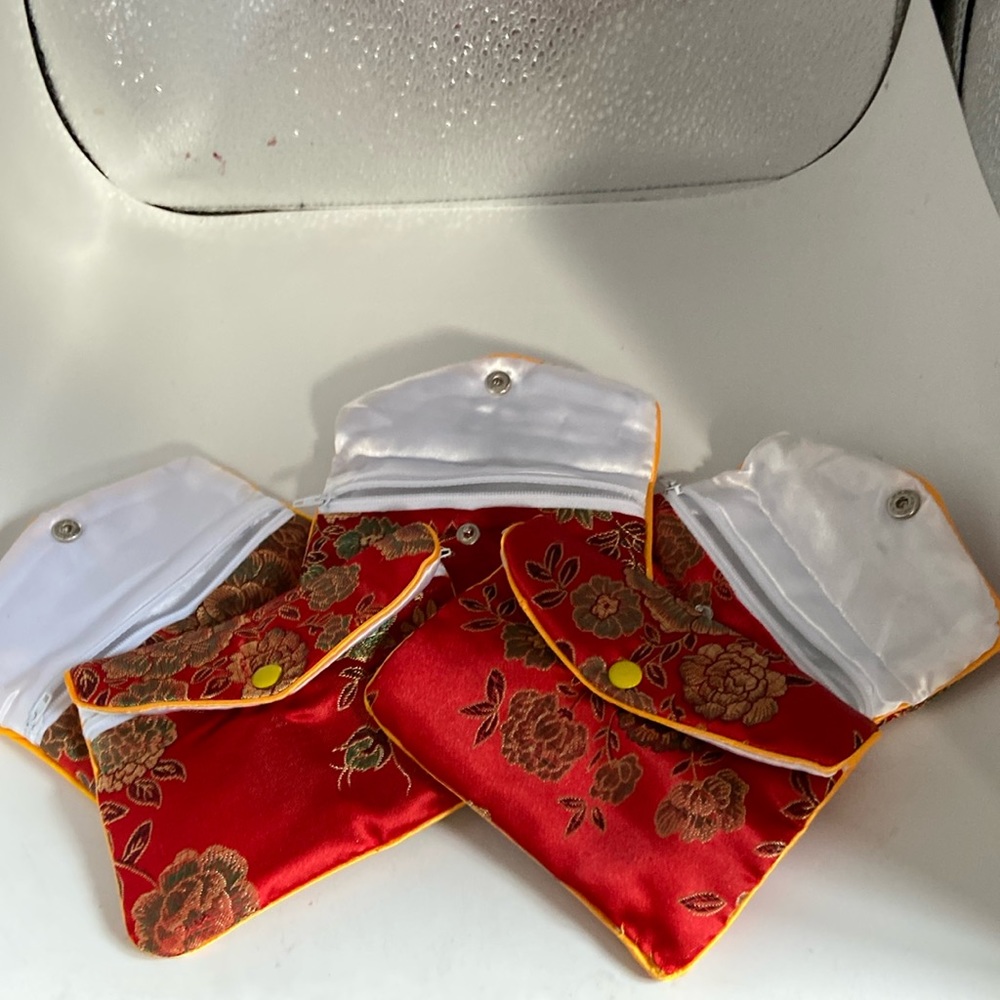 Silk jewelry pouches zipper closures So pretty Makes a great presentation NWOT